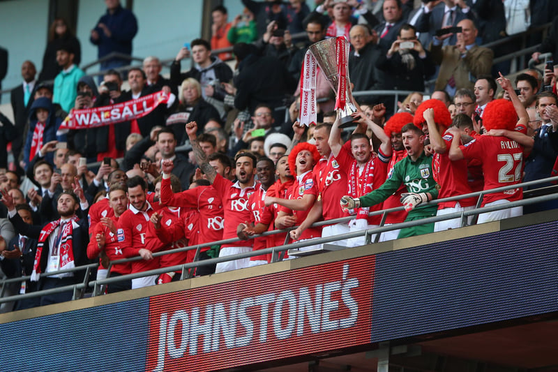 Wade Elliot and his Bristol City teammates lift the trophy after making their way up the Wembley Stadium steps