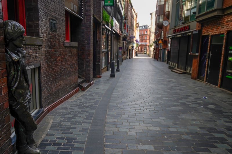 The statue of John Lennon stands in a deserted Mathew Street.