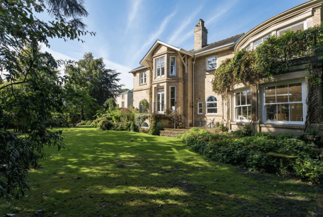 This gorgeous family home is set in stunning mature grounds