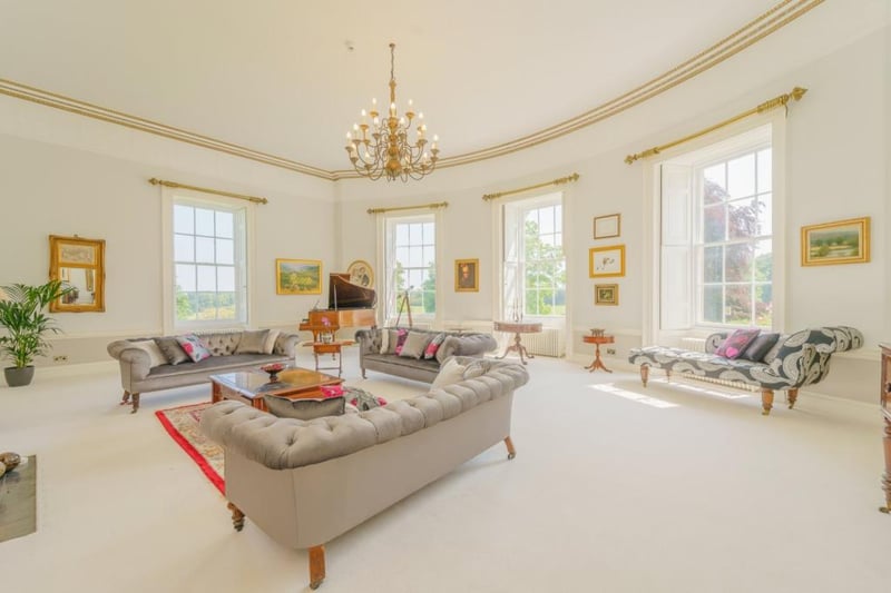 The inside of Milbourne Hall is just as well kept as its outside. You wouldn’t want any guests with a glass of red wine in this living room! (Image: Rightmove)
