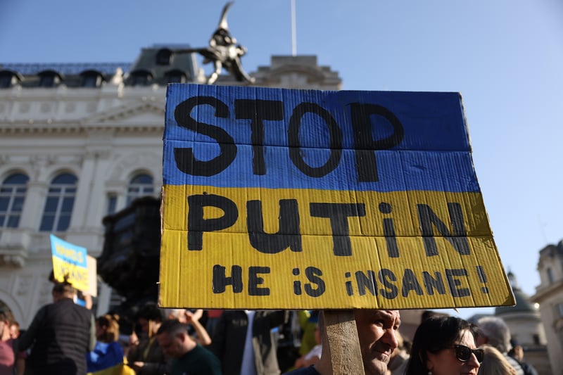 A placard reading ‘Stop Putin - he is insane’ at Piccadilly Circus during the march. Photo: Getty