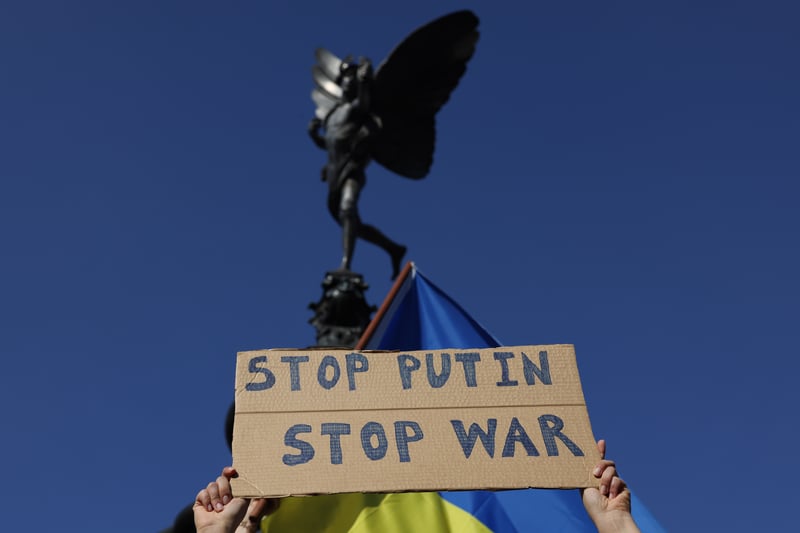 A placard reading ‘Stop Putin, Stop War’ held up during the vigil. Photo: Getty
