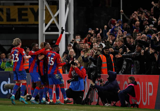 Crystal Palace fans celebrate with Eagles players after memorable win