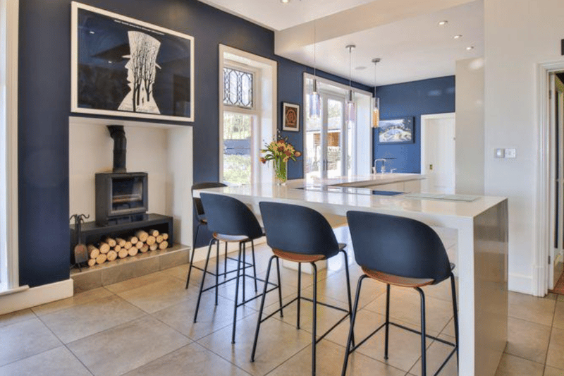The open plan kitchen dining area blends contemporary and traditional