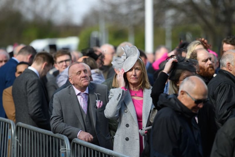 Racegoers queue to be let into the Grand National Festival 2022.