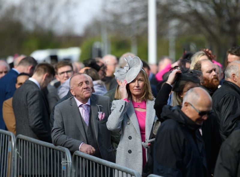 Racegoers queue to be let into the Grand National Festival 2022.