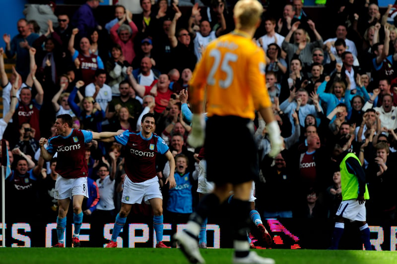James Milner and Stewart Downing celebrate after Milner dispatches a penalty past Birmingham City’s Joe Hart.