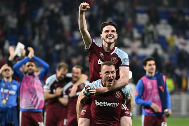 Declan Rice (up) and West Ham United's Czech defender Vladimir Coufal celebrate (Photo by JEFF PACHOUD/AFP via Getty Images)
