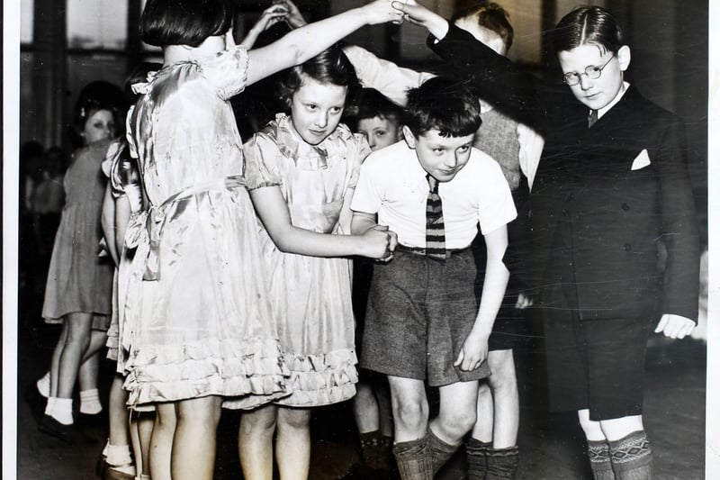 A team competing in the Manchester Schools’ Folk Dance Festival in the Whitworth Street Central School, Manchester, UK, 11 March 1939. Six hundred boys and girls, and one teacher, took part in the festival.  