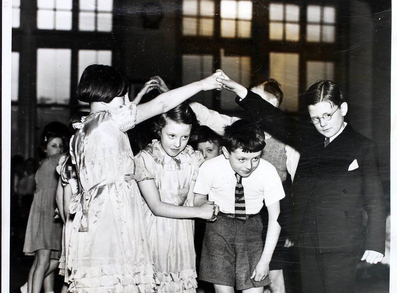A team competing in the Manchester Schools’ Folk Dance Festival in the Whitworth Street Central School, Manchester, UK, 11 March 1939. Six hundred boys and girls, and one teacher, took part in the festival.  