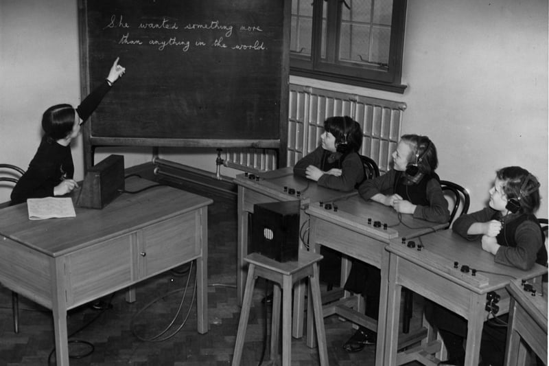22 February 1937:  In the amplifier room at the Royal Residential Schools for the Deaf at Old Trafford partlally deaf children listen to the teacher through headphones.  