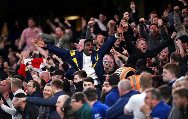 The Arsenal fans in full flow after the first goal