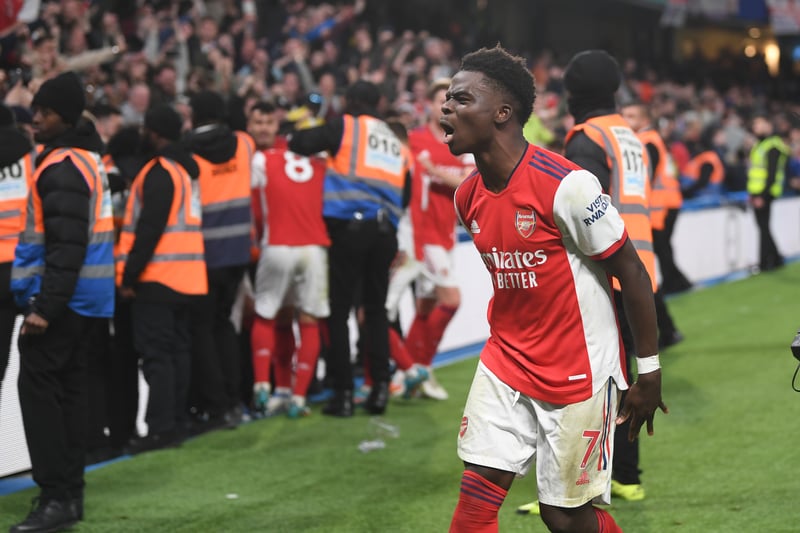 Saka storming into the Arsenal fans to celebrate after scoring the fourth goal