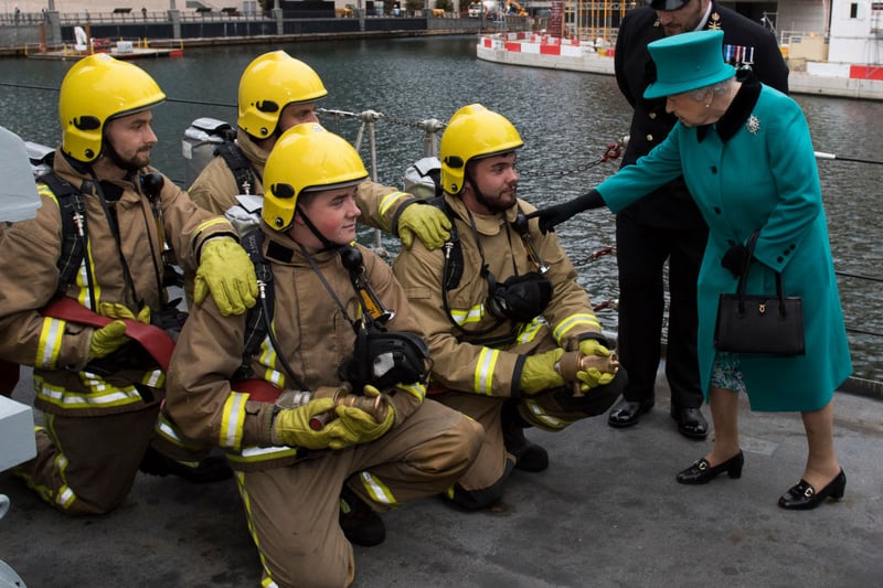  Queen Elizabeth II meets personnel as she visits HMS Sutherland in the West India Dock as the ship celebrates its 20th anniversary of her Commissioning on October 23, 2017