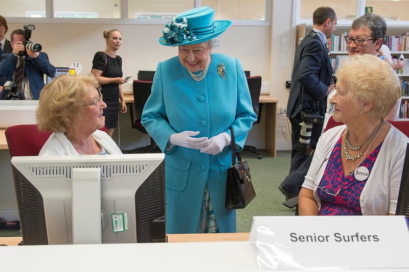 Queen Elizabeth II meets a group of Senior Surfers during a visit to Chadwell Heath Community Centre on July 16, 2015 in Chadwell Heath, east London.