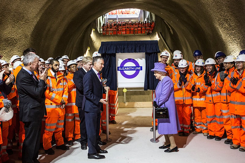 Queen Elizabeth unveils the new roundel for the Crossrail line next toTerry Morgan, Chairman of Crossrail and London’s mayor Boris Johnson during a visit to the site of the new Crossrail Bond street station  on  February 23, 2016