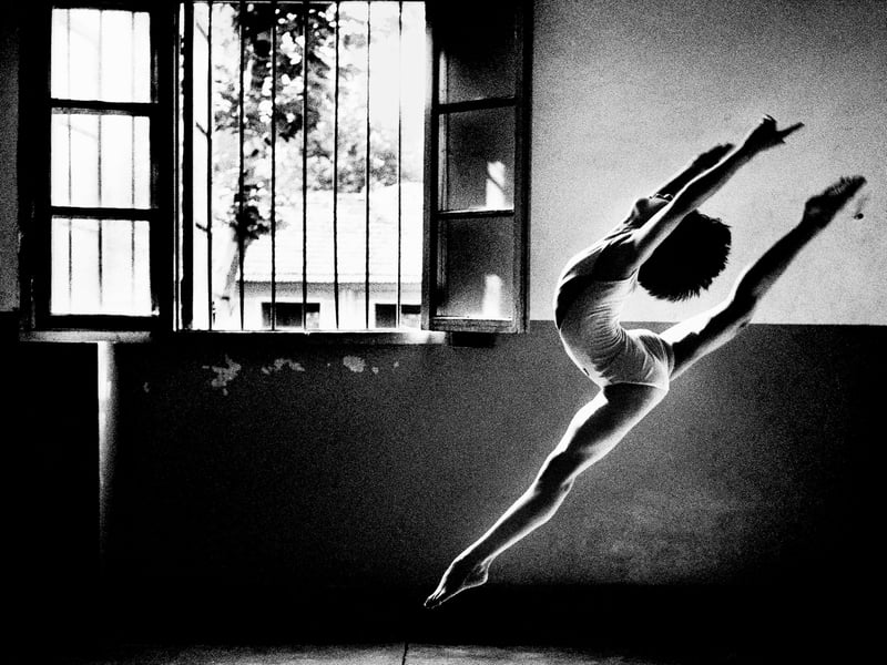 An extraordinary young gymnast practices her leaps at Wuhan School of Sport in a powerful photo taken by Tom Stoddart