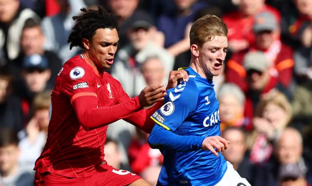  Anthony Gordon of Everton is challenged by Trent Alexander-Arnold of Liverpool during the Premier League match between Liverpool and Everton at Anfield on April 24, 2022 in Liverpool, England. (Photo by Clive Brunskill/Getty Images)