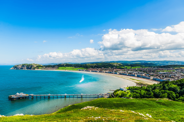 Llandudno is a seaside town in North Wales. As well as its beaches and Victorian pier, it also has a mini-mountain, which you can travel up via the historic Great Orme Tramway. (Credit: Adobe)