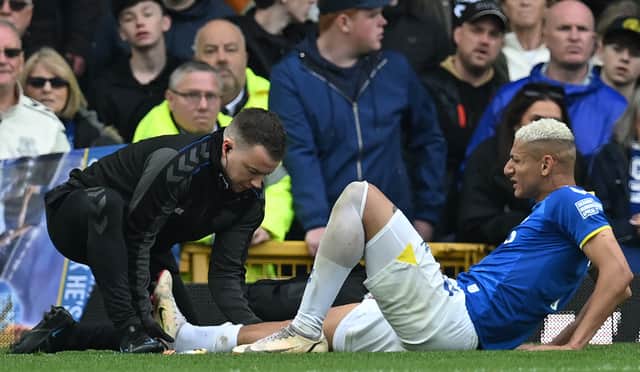 Richarlison receives treatment during Everton’s defeat of Chelsea. Picture: PAUL ELLIS/AFP via Getty Images