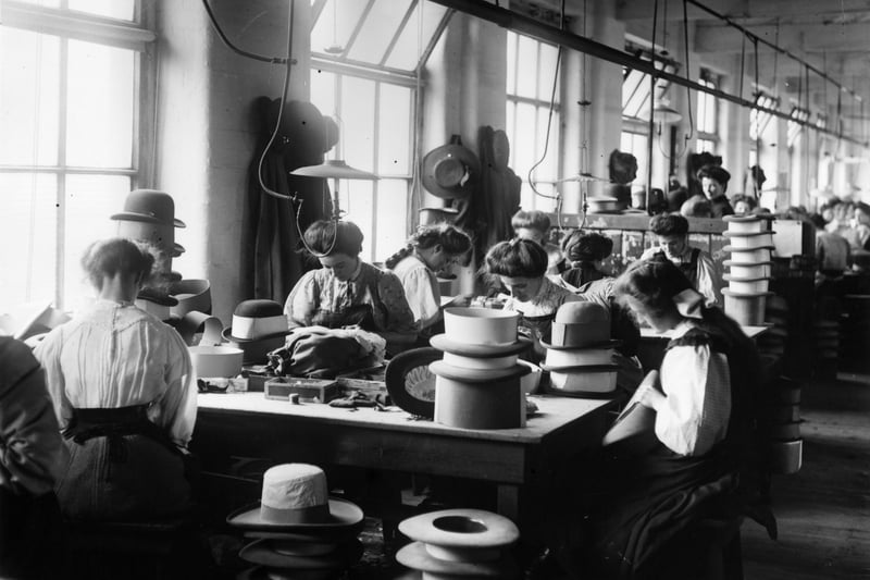 July 1909:  Women making hats at the Sutton & Torkington factory in Manchester. 