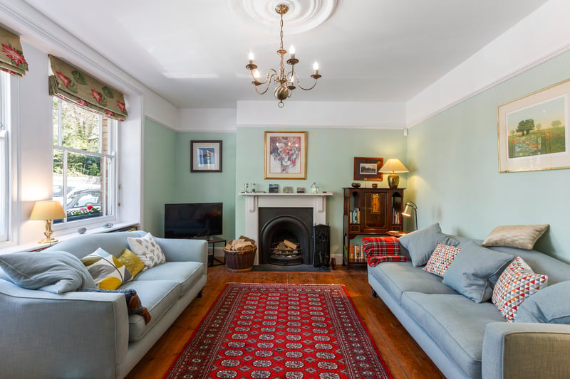 The sitting room is a generously proportioned elegant room with high ceiling, cornice and central rose.