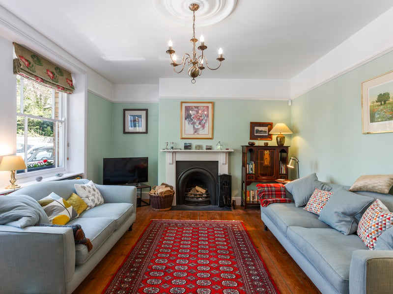 The sitting room is a generously proportioned elegant room with high ceiling, cornice and central rose.