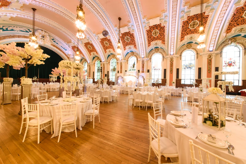 The beautiful baroque Grade II listed building has stunning marble staircases, a sweeping entrance to create an impression, and a huge ballroom with high ceilings and stained glass windows - with room for up to 600 guests.