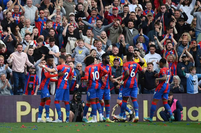 Wilfried Zaha of Crystal Palace celebrates with teammates after scoring their team’s first goal (Photo by Tom Dulat/Getty Images)