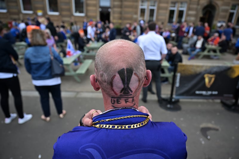 One supporter marks the final with a Europa League logo haircut.