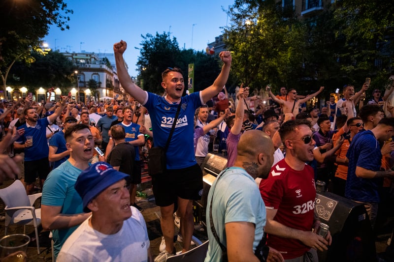 Fans sing outside the stadium ahead of the final.