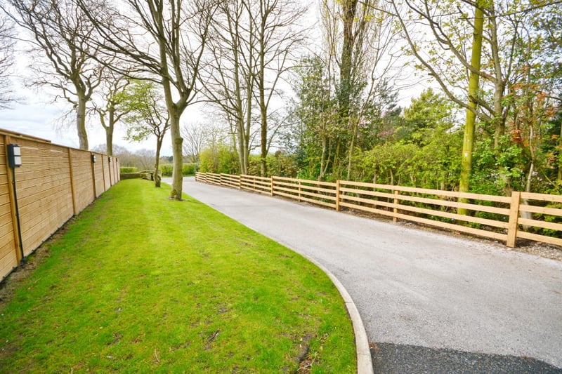 The property sits within its own grounds at the top of a private drive (which could be gated). 