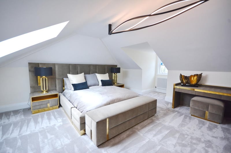 The bedroom features a large Velux window to the rear, with a sash window to the front. 