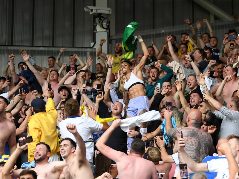 The Brazilian star celebrates with Leeds supporters after playing a crucial role in keeping the club in the Premier League.