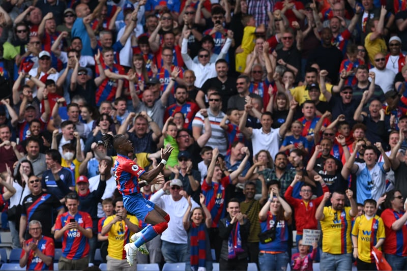 Crystal Palace’s Ivorian striker Wilfried Zaha celebrates after scoring the opening goal 