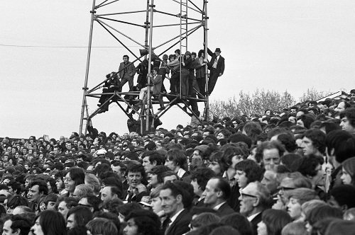 Birmingham fans climb the floodlights at Leyton Orient to get a better view of the match in 1972.