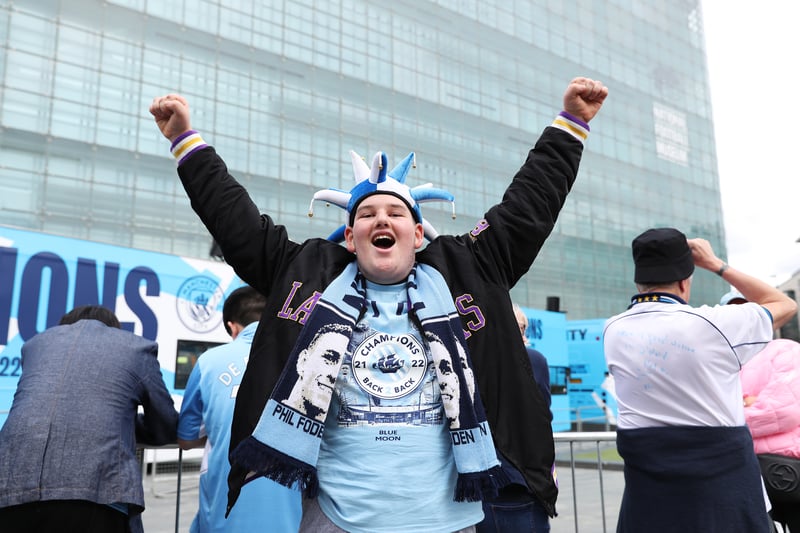 A fan in fine voice shows support ahead of the parade