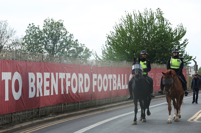 Police are seen on horseback outside the stadium prior to the Premier League match 