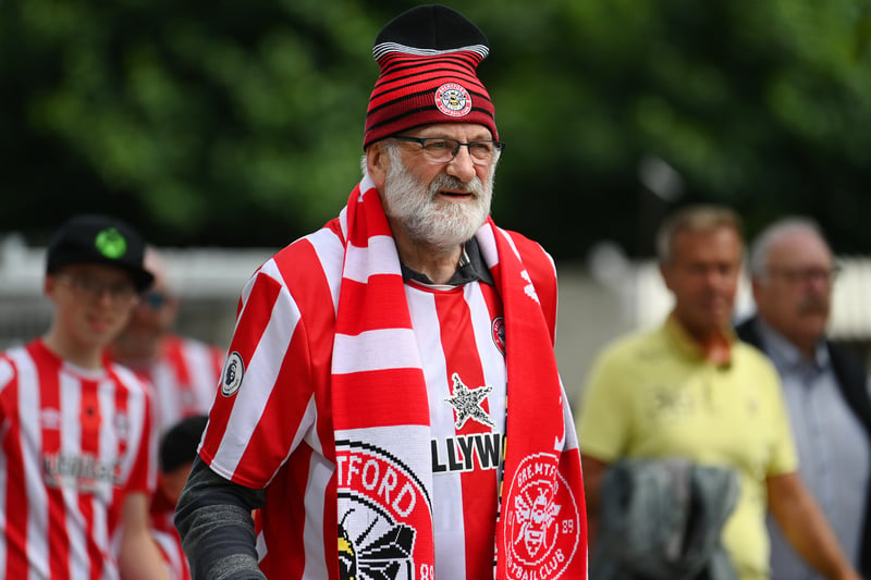  A Brentford fan arrives at the stadium prior to the Premier League match 