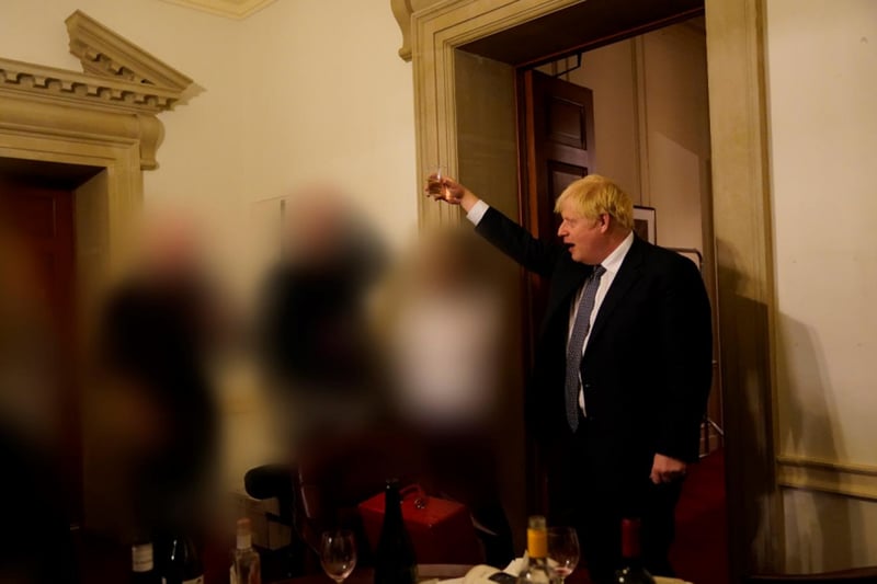 Boris Johnson appears to raise a toast. Sue Gray’s report states: “He went to the press office area, joined the gathering and made a leaving speech for Lee Cain. Wine had been provided and those attending, including the prime minister, were drinking alcohol.”