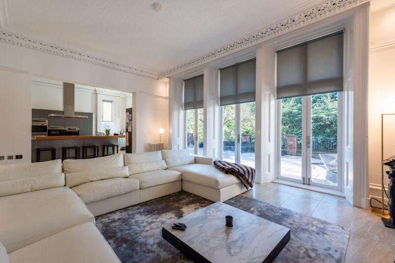 The french doors are floor to ceiling and let in an abundance of natural light. 