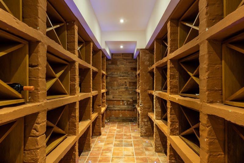 The wine cellar is on the ground level of the property.