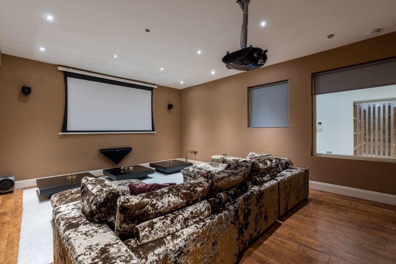 The property boasts its very own cinema room with a pull down screen and projector. 