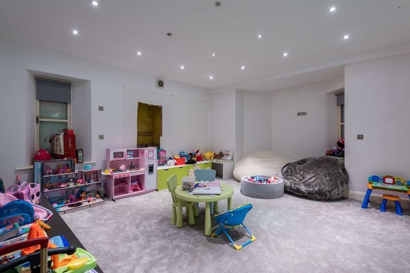 The play room is spacious with tonnes of space for toys and games. 