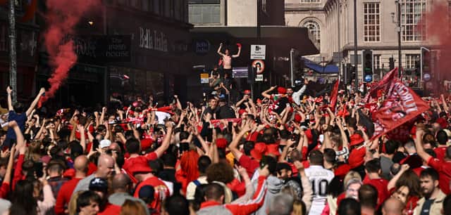 Liverpool supporters gather in the city centre in Liverpool ahead of the UEFA Champions League final football match between Liverpool and Real Madrid  being played at the Stade de France in Saint-Denis, north of Paris, on May 28, 2022. (Photo by Oli SCARFF / AFP) (Photo by OLI SCARFF/AFP via Getty Images)