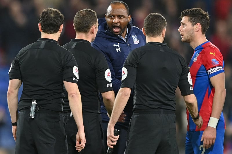 Crystal Palace’s English defender Joel Ward (R) watches as Crystal Palace’s French manager Patrick Vieira remonstrates with the referee 