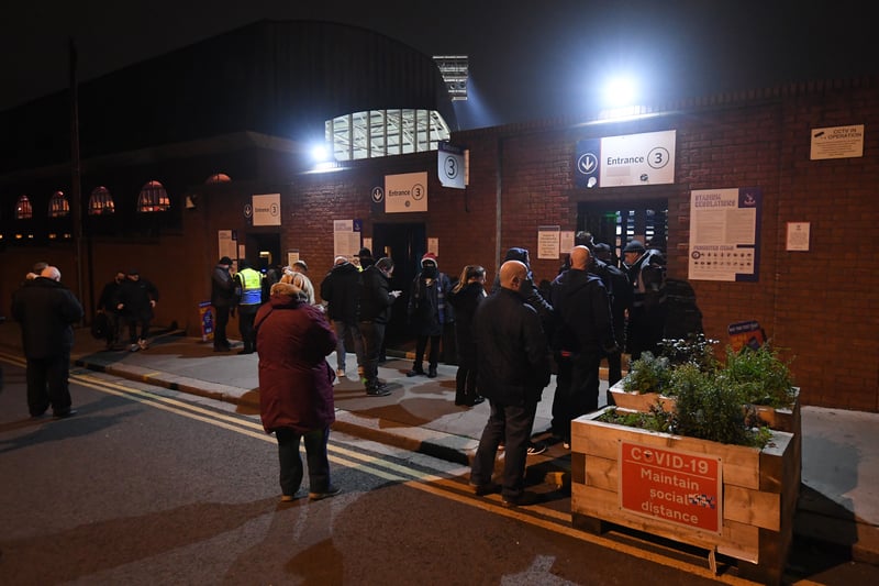 Fans enter a COVID-19 checkpoint outside the stadium prior to the Premier League match between Crystal Palace and Southampton