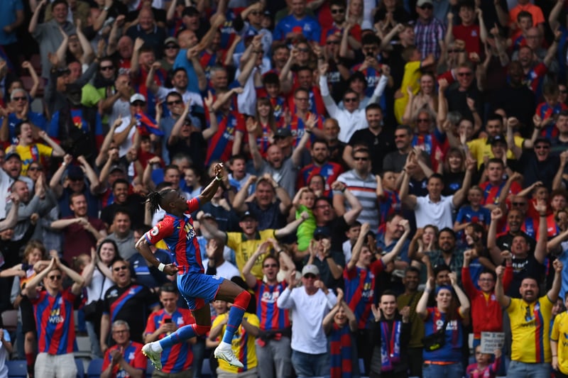 Wilfried Zaha of Crystal Palace celebrates scoring his team’s first goal during the Premier League match 