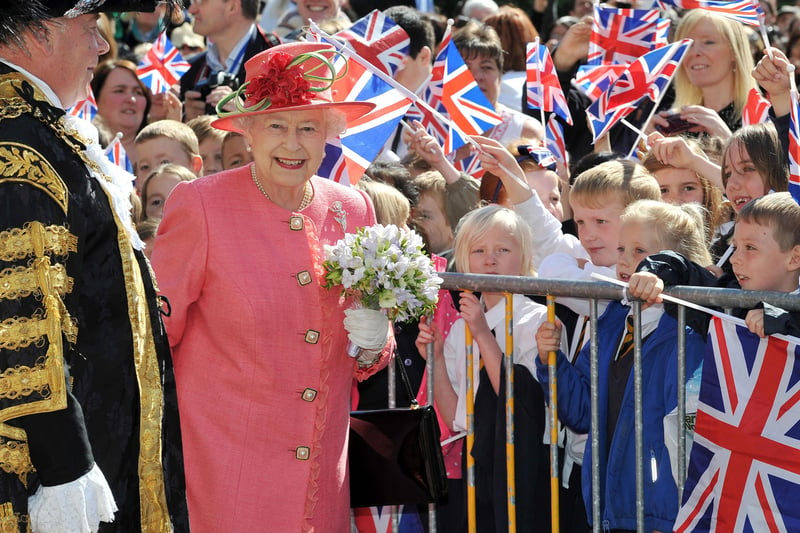 Queen Elizabeth II greets schoolchildren in Victoria Square during her Diamond Jubilee visit to Birmingham on July 12, 2012 (Photo by Tim Ireland - WPA Pool/Getty Images)