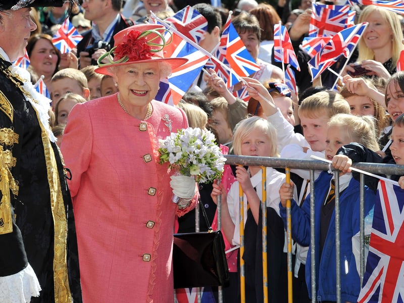 Queen Elizabeth II greets schoolchildren in Victoria Square during her Diamond Jubilee visit to Birmingham on July 12, 2012 (Photo by Tim Ireland - WPA Pool/Getty Images)